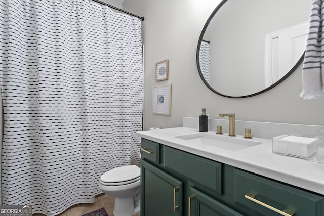 bathroom with vanity, toilet, and tile patterned floors