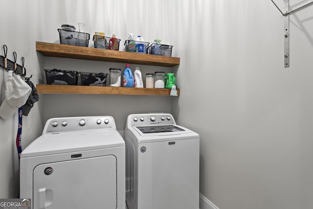 washroom with laundry area and washing machine and dryer