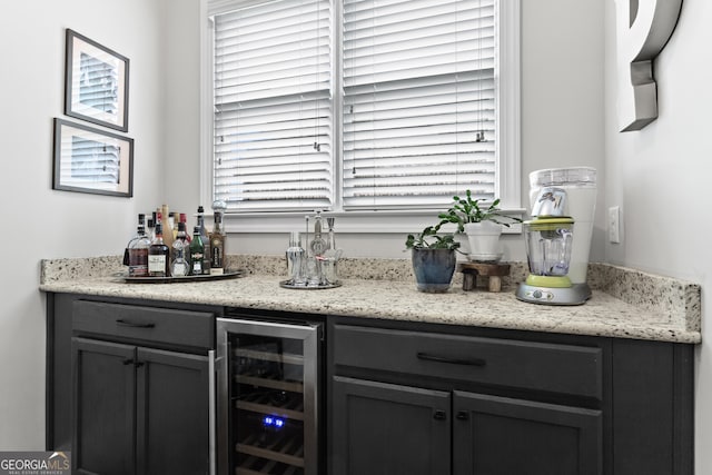 bar with wine cooler and a bar