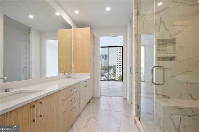 2425 Peachtree Rd NE Unit 903, Atlanta, GA 30305 - full bath with a sink, a marble finish shower, marble finish floor, and double vanity