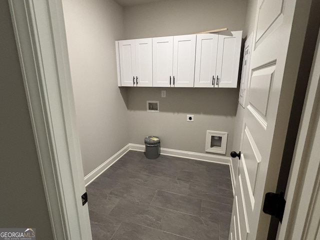 washroom featuring washer hookup, hookup for an electric dryer, cabinet space, and baseboards