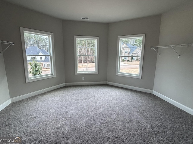 interior space featuring baseboards and visible vents