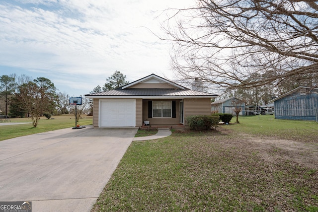 view of front of house with driveway, metal roof, an attached garage, and a front lawn