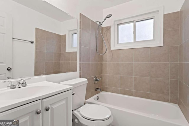 bathroom featuring shower / washtub combination, vanity, and toilet