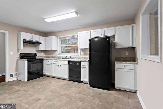 kitchen with visible vents, white cabinetry, black appliances, under cabinet range hood, and baseboards