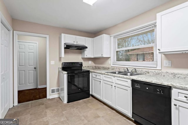 kitchen with black appliances, under cabinet range hood, white cabinetry, and a sink