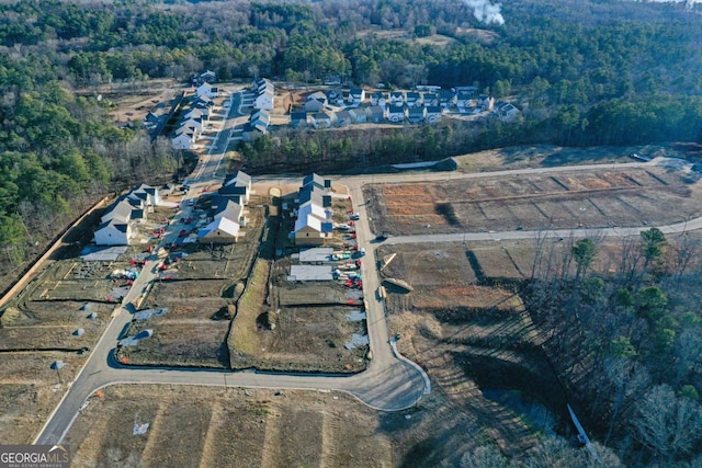 birds eye view of property with a residential view