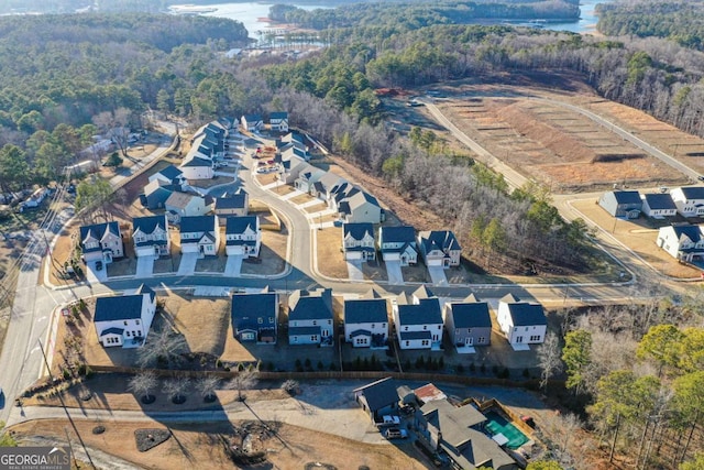 birds eye view of property with a residential view