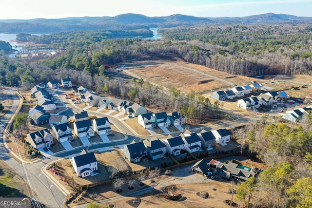 drone / aerial view featuring a residential view and a mountain view