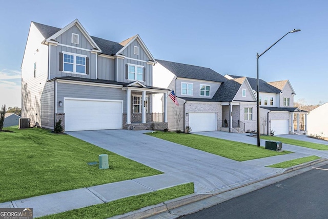 view of front of home with a garage, concrete driveway, board and batten siding, and a residential view