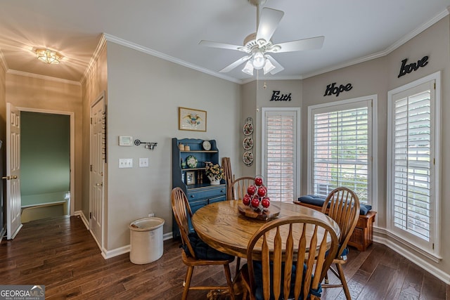 dining area with ornamental molding, dark wood-type flooring, a ceiling fan, and baseboards