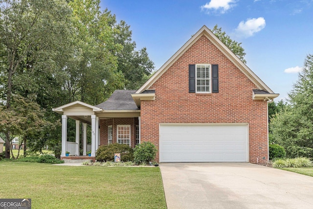 traditional-style house with concrete driveway, brick siding, and a front lawn