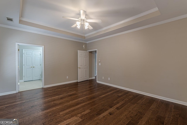 unfurnished bedroom featuring visible vents, baseboards, a ceiling fan, ornamental molding, and dark wood-style flooring