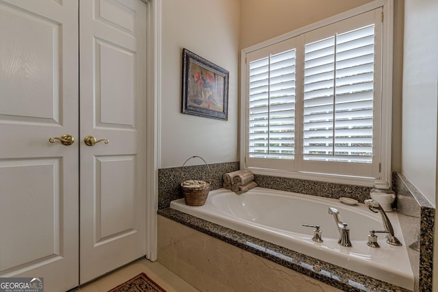 full bath with a closet and a garden tub