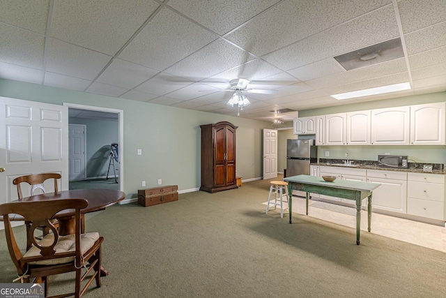 game room with light carpet, baseboards, ceiling fan, a paneled ceiling, and a sink