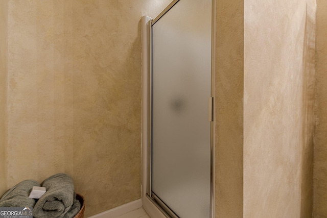 full bathroom with a shower with shower door