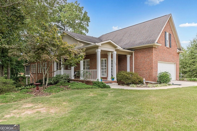 view of front of home with brick siding, a porch, an attached garage, and a front yard