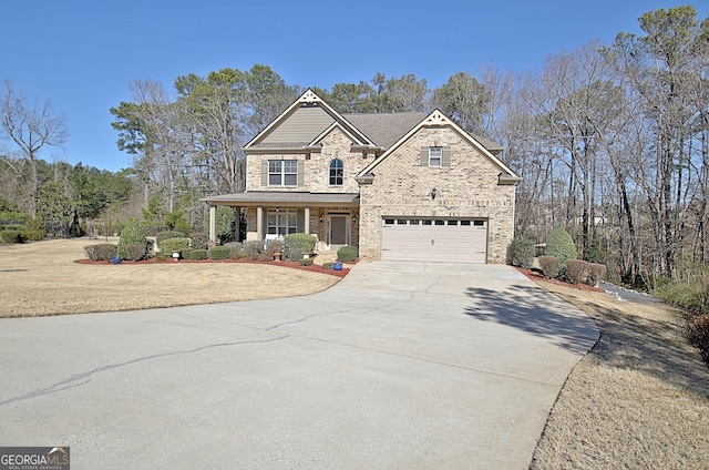 view of front facade with driveway, brick siding, a porch, and an attached garage