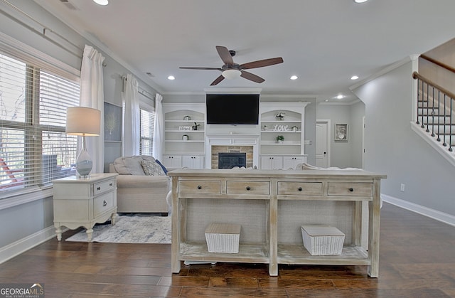 living room with dark wood-style floors, stairs, and crown molding