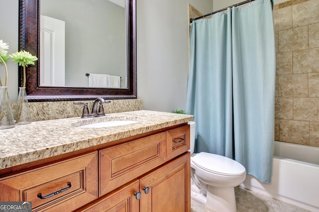 bathroom with shower / bath combo with shower curtain, vanity, and toilet