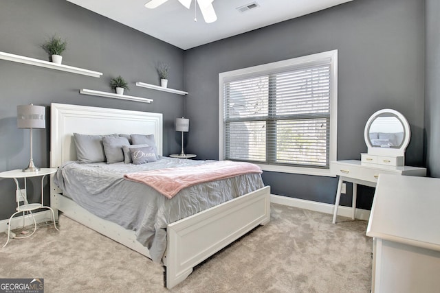 bedroom with light carpet, baseboards, visible vents, and ceiling fan