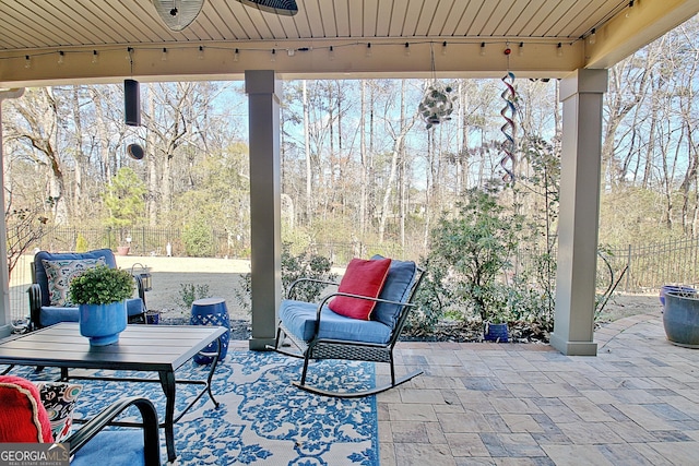 view of patio featuring fence