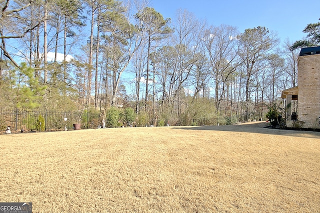 view of yard featuring fence