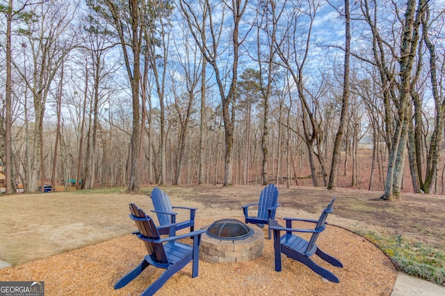 view of yard with an outdoor fire pit