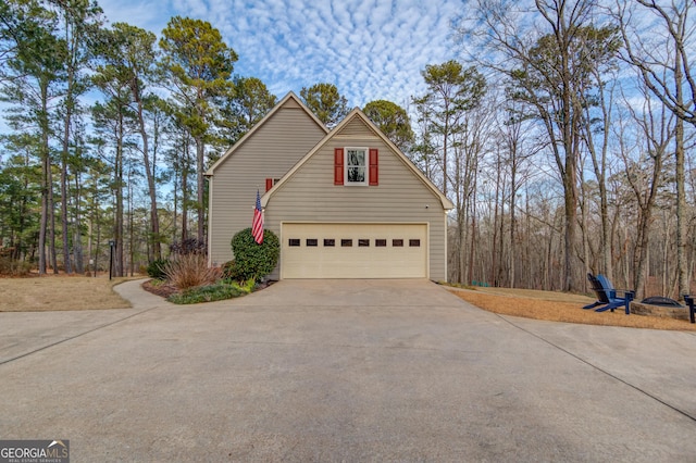 view of property exterior featuring driveway