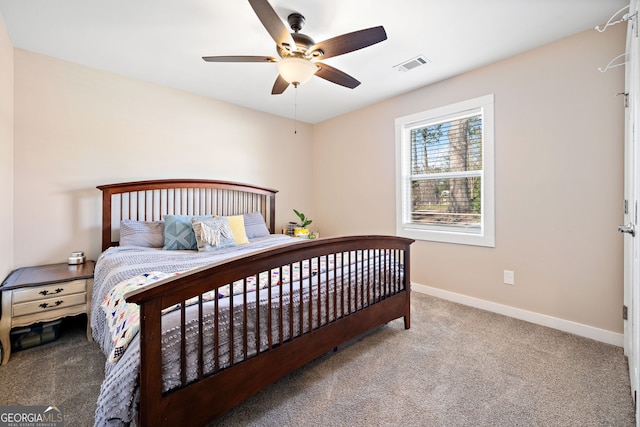 carpeted bedroom with visible vents, ceiling fan, and baseboards