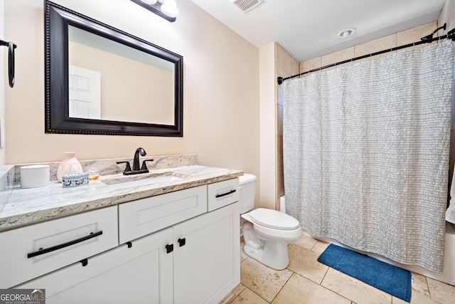 bathroom with shower / bath combo, visible vents, toilet, tile patterned flooring, and vanity