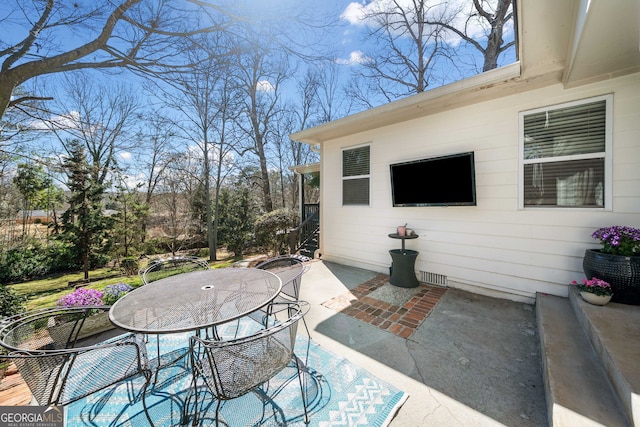 view of patio featuring outdoor dining space