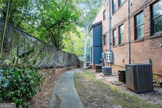 view of yard featuring a fenced backyard and central AC unit