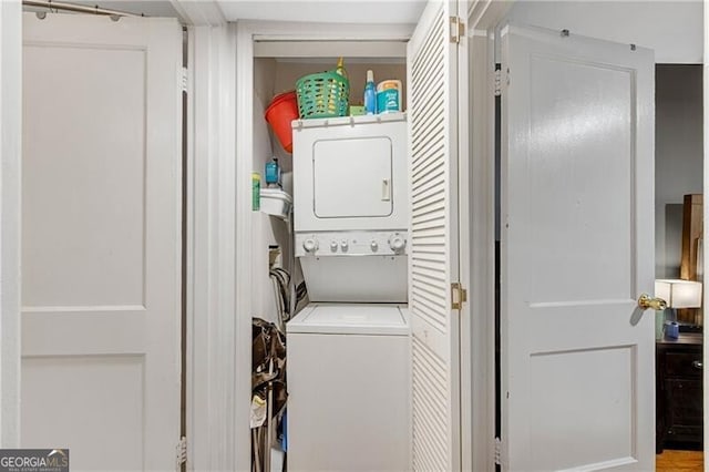 laundry room featuring laundry area and stacked washing maching and dryer