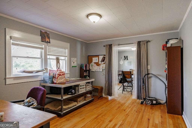 office space featuring ornamental molding and wood finished floors