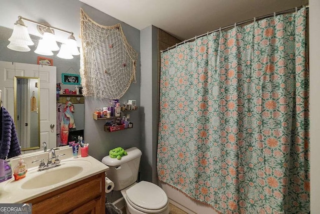 full bath featuring curtained shower, vanity, and toilet