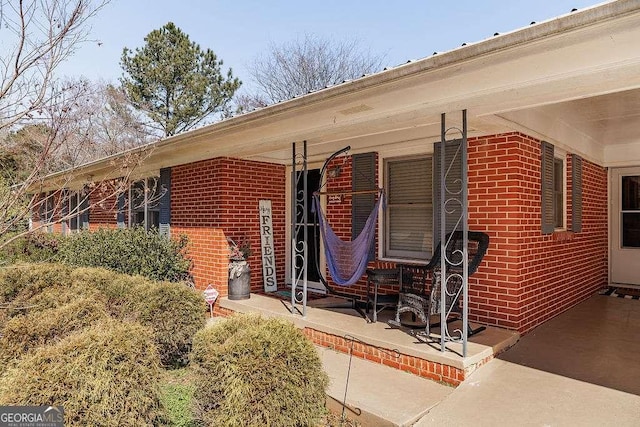 view of side of home featuring brick siding