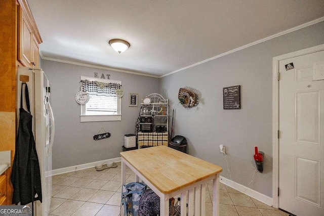 office featuring ornamental molding, baseboards, and light tile patterned floors