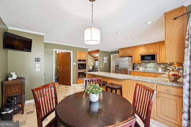 dining room with a textured ceiling, ornamental molding, recessed lighting, and baseboards