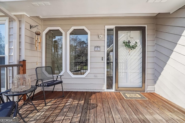 property entrance with visible vents