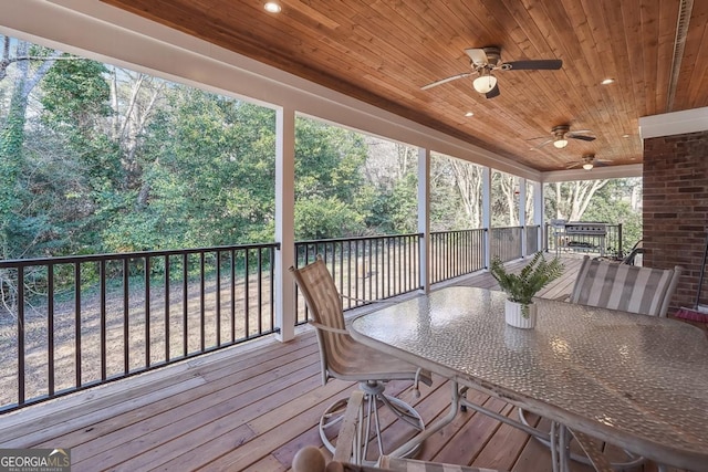 wooden deck with ceiling fan and outdoor dining area