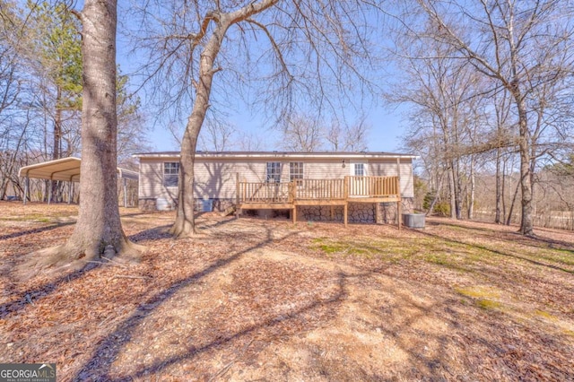 view of front facade featuring a deck and a detached carport