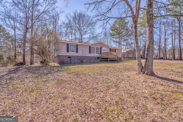 view of front of home featuring a deck and crawl space