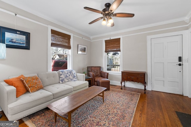 living area featuring ornamental molding, a ceiling fan, plenty of natural light, and hardwood / wood-style flooring