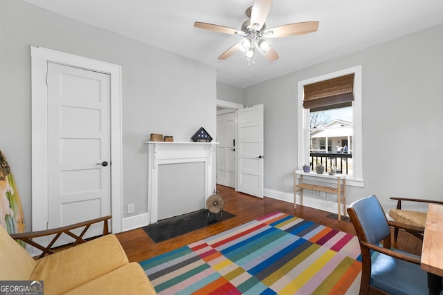 bedroom featuring baseboards and wood finished floors