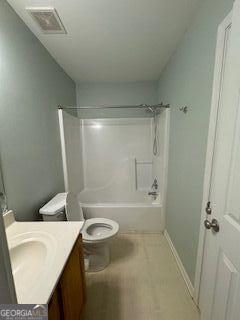 full bathroom featuring toilet, vanity, visible vents, baseboards, and shower / bathing tub combination