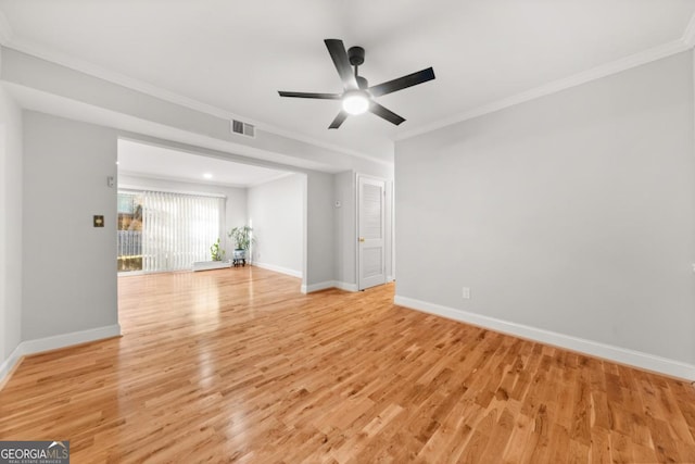 unfurnished living room with baseboards, light wood-style flooring, visible vents, and crown molding