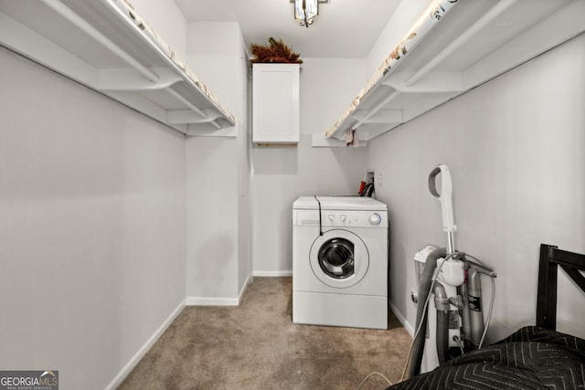 washroom with washer / dryer, laundry area, light colored carpet, and baseboards