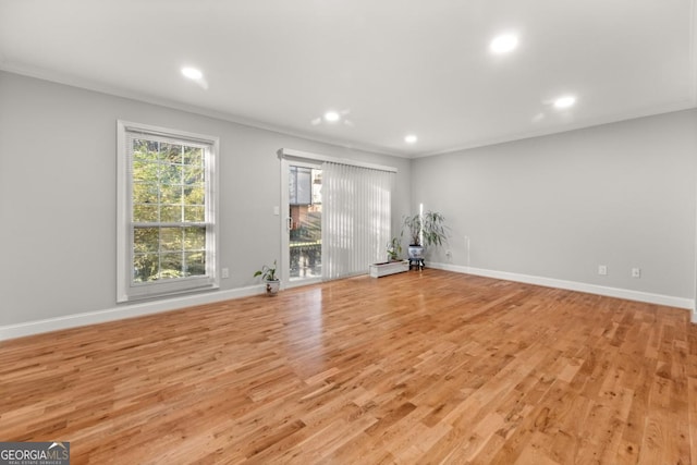 unfurnished living room featuring light wood-style flooring, baseboards, and recessed lighting