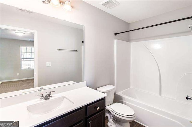 bathroom featuring toilet, shower / bathtub combination, vanity, and visible vents